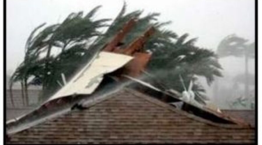 Wind blows the roof of a house apart